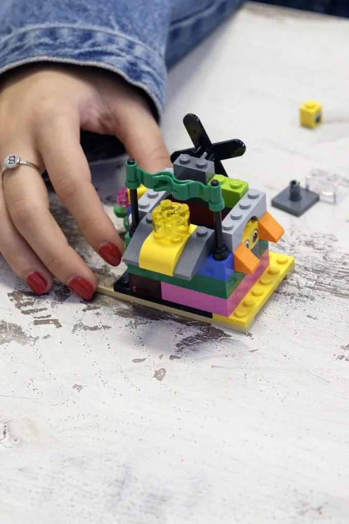 Lego construction with author's hand.