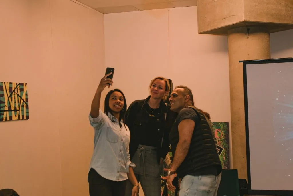 Three of the participating presenters taking a picture.