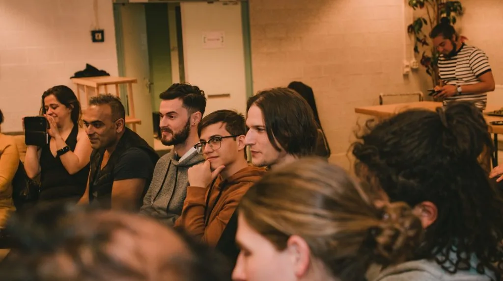 Audience members, eight people.