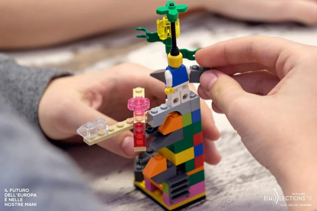 Lego construction with author's hands.