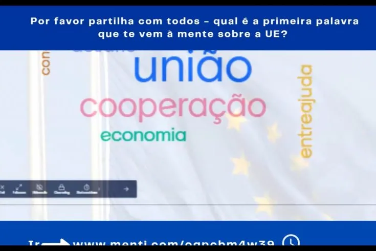 Videoconference still showing a multi-colored word cloud.