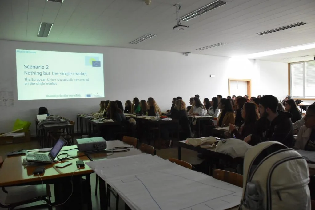 Information about "Scenario 2" being projected for the classroom full of participants.