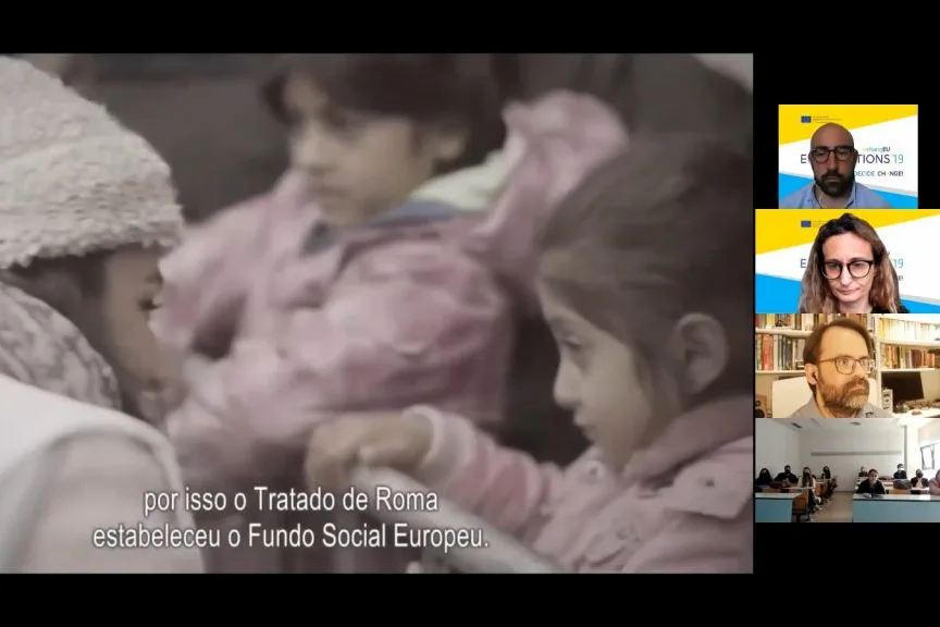 Videoconference still showing the classroom and the representatives on the call, beside an image of the  video on EU history.
