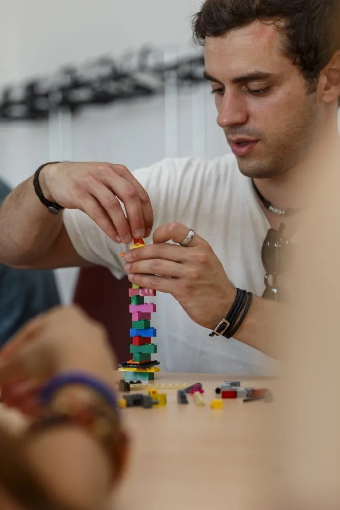 Participant making a Lego construction.